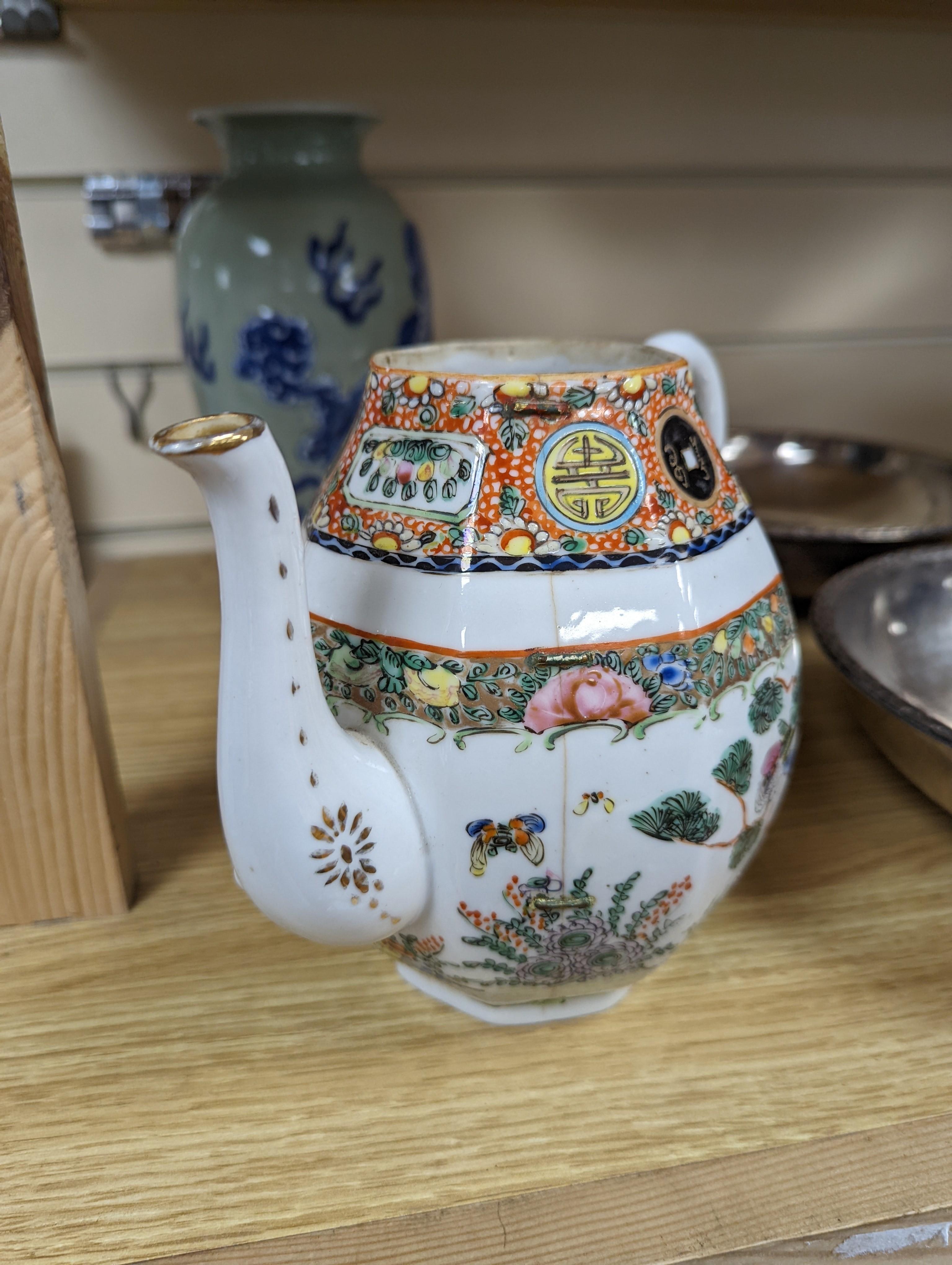 A Chinese celadon glazed vase, 24cm and a Chinese famille rose teapot and matching cream jug, a.f.